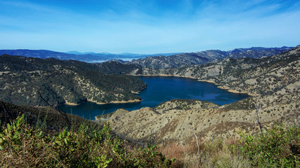 Fototapeta na wymiar Aerial view of Lake Berryessa from the Blue Ridge Trail, Stebbins Cold Canyon, on a sunny day, featuring the surrounding blue oak woodland after the 2015 wragg fire