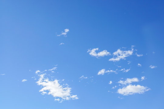 Deep Blue Sky With Tiny Clouds