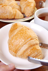  Delicious croissants on white plate  