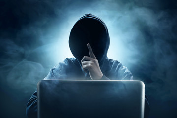 Hacker using laptop - obrazy, fototapety, plakaty
