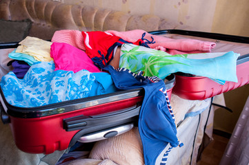 Charges for the journey, an open suitcase with women's things