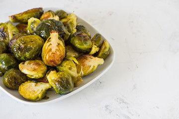 Cooked Brussels sprouts in a white plate