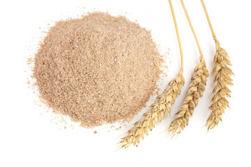 Pile of wheat bran with ears isolated on white background