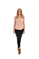 Fototapeta premium full length portrait of a girl wearing pink shirt and black floral pants. standing pose, isolated on white background.