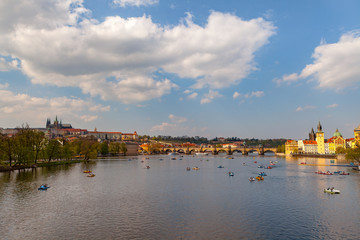 Obraz premium View on the river Vltava with boats. Old town of Prague, Czech Republic, summer season.