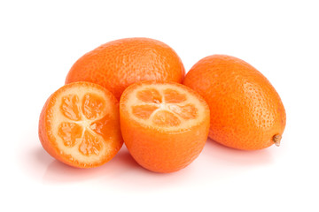Cumquat or kumquat with half isolated on white background close up