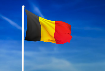 Waving flag of Belgium on the blue sky background