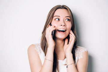 Fototapeta premium Happy woman phone talking. Face with toothy smile, isolated over white