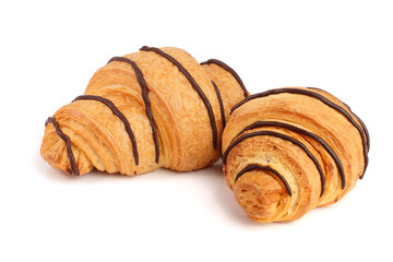 croissant decorated with chocolate sauce isolated on white background, top view