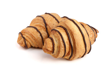 croissant decorated with chocolate sauce isolated on white background, top view