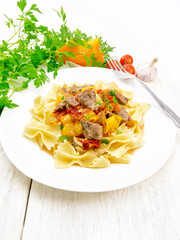 Farfalle with turkey and vegetables on light board