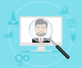 A magnifying glass looks at the person in the computer.