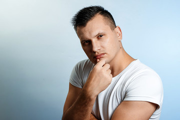 Closeup portrait of arrogant young man in brown shirt who thinks highly of himself, isolated on white background. Negative human emotion facial expressions