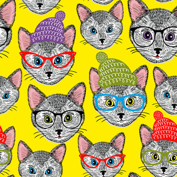 Colorful seamless pattern with cats in hats and glasses.