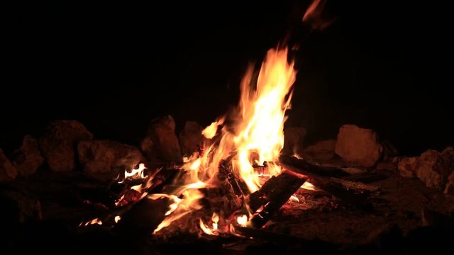 Bonfire burning trees at night. Bonfire burning brightly, heat, light,camping, big bonfire, close up