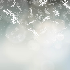 Winter background with a falling snowflakes
