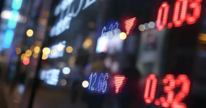 Stock market graph in city at night