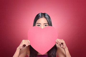 Beautiful asian woman with red heart shape