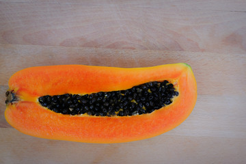 Sliced papaya on wooden background