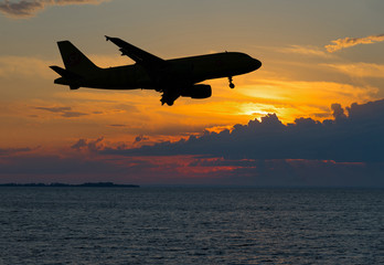 Fototapeta na wymiar Contour of Passenger plane over night sea