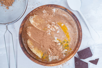 Smoothie bowl with chocolate, banana, coconut and passion fruit.