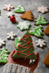 New year's tree cookies in hand