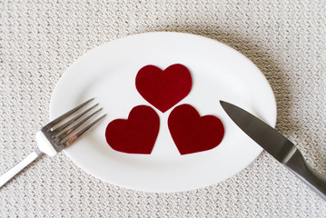 A table setting with dishware and heart . Top view.