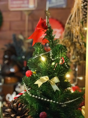 Decorated Christmas tree in coffee cafe interior.