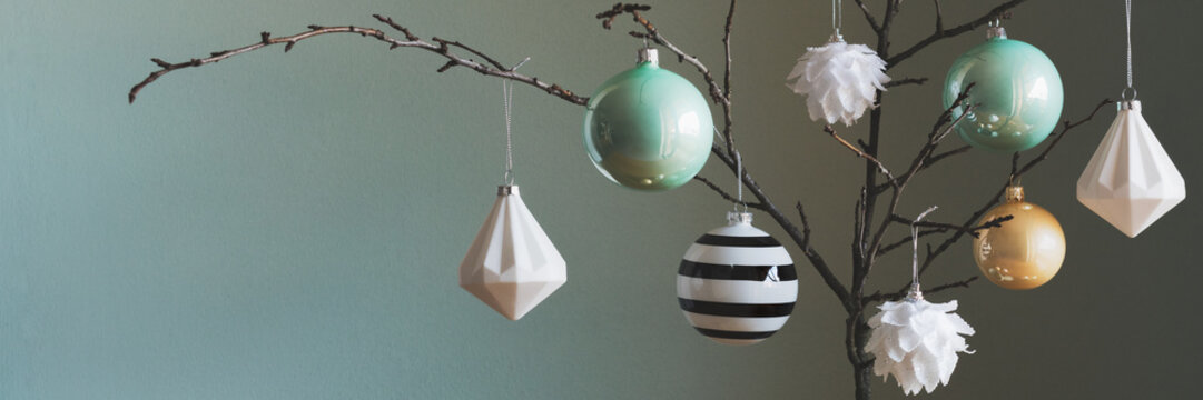 Modern and elegant simple nordic christmas tree decorations in black, white, gold and turquoise colors