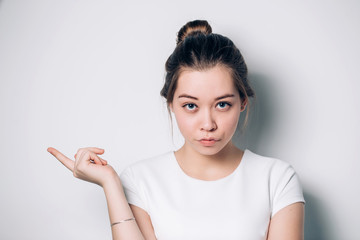 Smiling business woman pointing finger on copy space. isolated portrait.