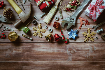 Merry christmas and Happy New year with handy tools  background concept, Used old rusty constructor tools with Christmas decoration on wood