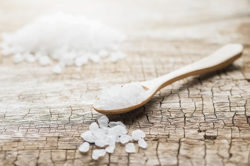 sea salt in wooden bowl and spoon