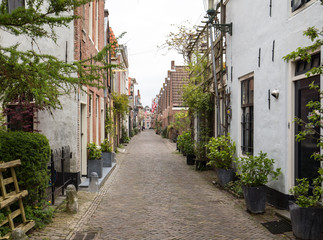 Fototapeta na wymiar Historic old town of Alkmaar, North Holland, Netherlands, typical canal houses