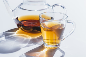 herbal tea in cup and kettle