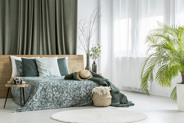 King-size bed in olive bedroom