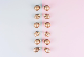 Christmas tree balls on a gray and pink background