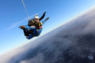 Fototapeta na wymiar Skydiving. Amazing tandem jump.