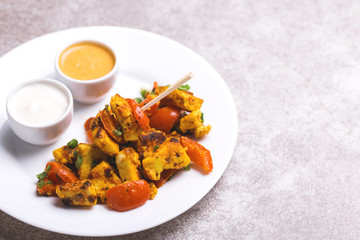 Indian cuisine. Paneer Tikka Kabab. Asian salad. Horizontal view