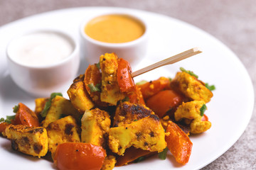 Indian cuisine. Paneer Tikka Kabab. Asian salad. Horizontal view