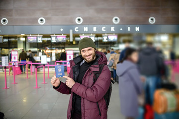 Fototapeta premium Biometric passport of Ukraine. A man at the airport in Gdansk, Poland.