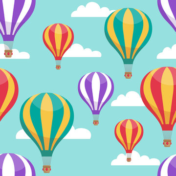 Cartoon hot air balloons in blue sky vector seamless pattern for air travel concept