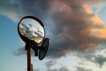 Japanese curve mirror reflecting the sunset cloud