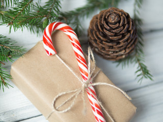 candy cane is a traditional sweet and gift box. lies bump and tree branches