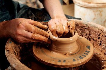 Potter at work. Workshop place.