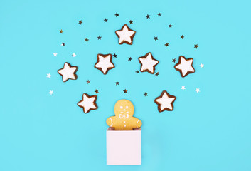 Christmas composition with gingerbread man in a pink box.