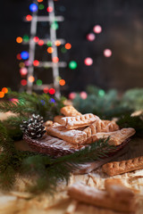 Fototapeta na wymiar homemade cookies on the festive New Year's table. Christmas tree and garland