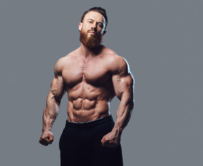 Portrait of bearded shirtless bodybuilder.