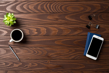 Business supplies on wooden table