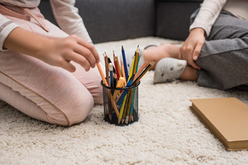 kid taking pencils