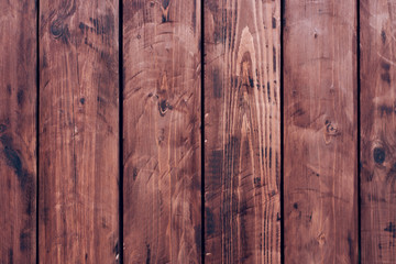 Brown, wooden board fence. Dark vintage wooden boards. Backgrounds and textures fence painted. Front view. Attract a beautiful vintage.